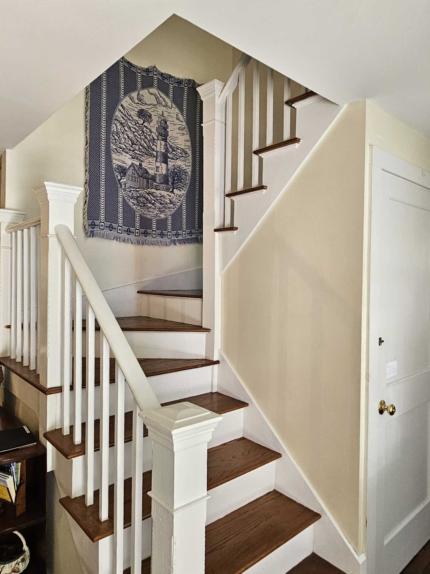 Stairs in entry  to second floor