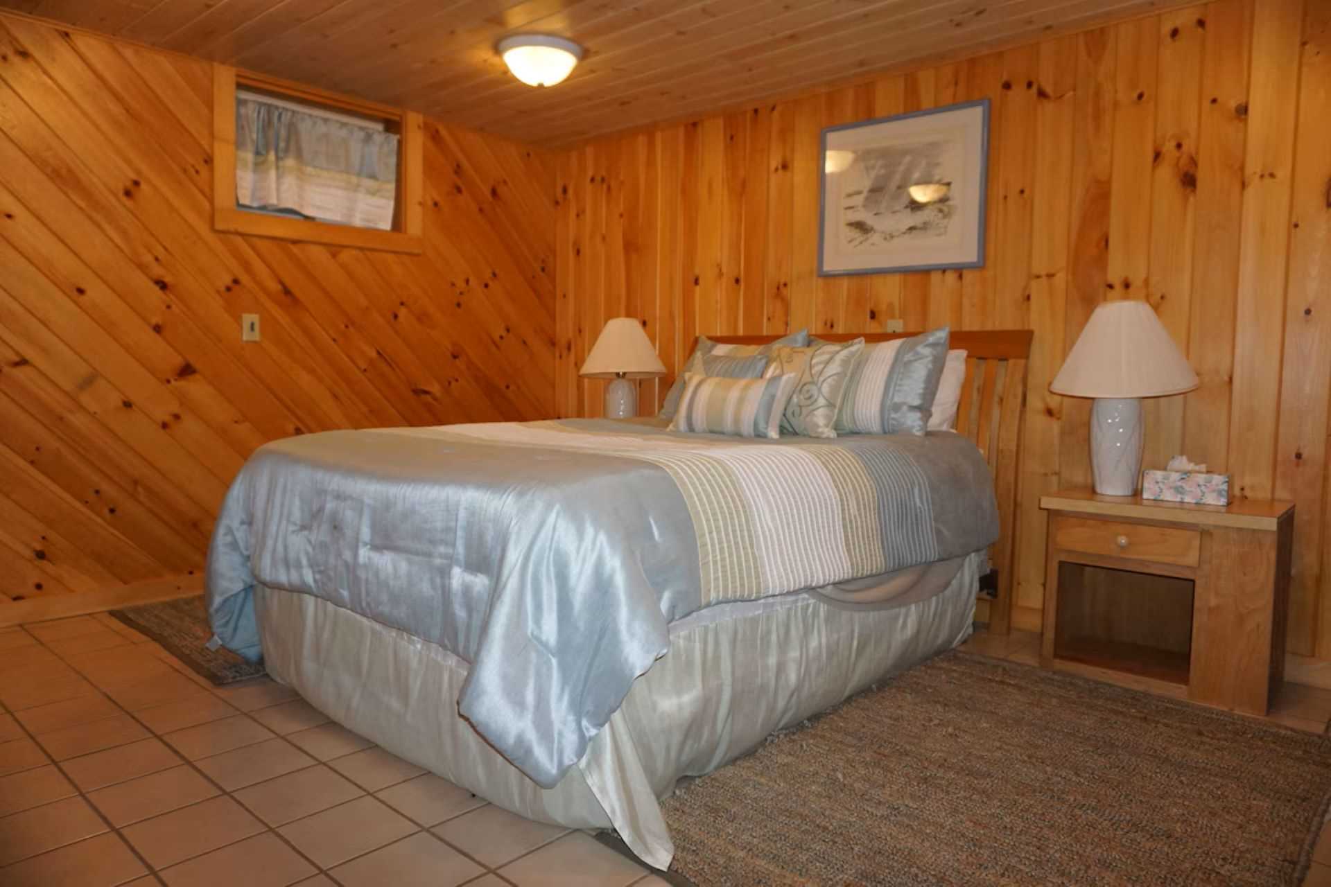 Lower level bedroom with queen bed and private bath