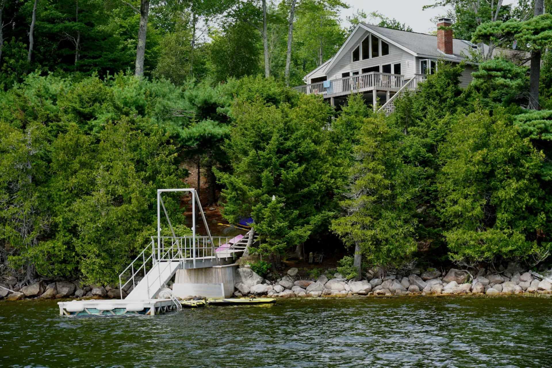 The dock and vacation home viewed from the lake