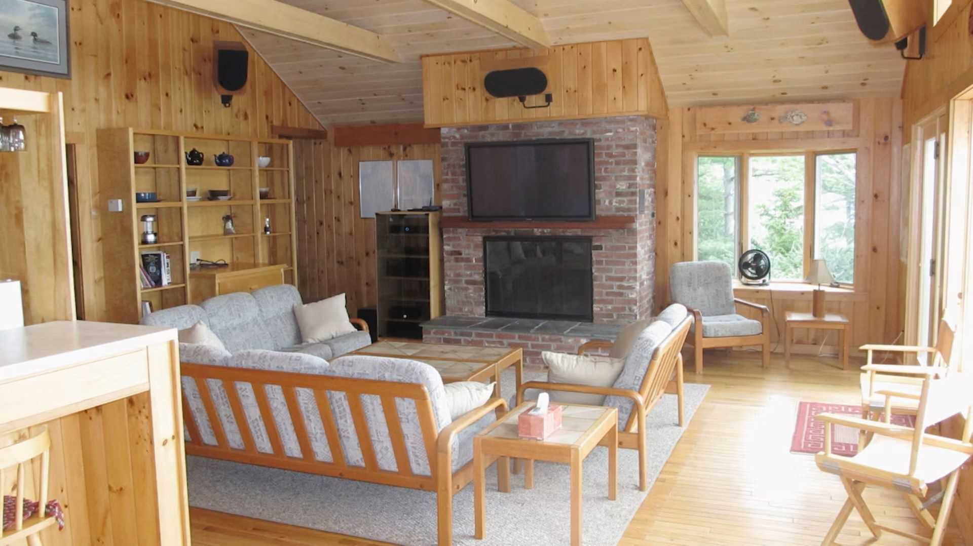 The main living area seats 8 with a high end home theater sy