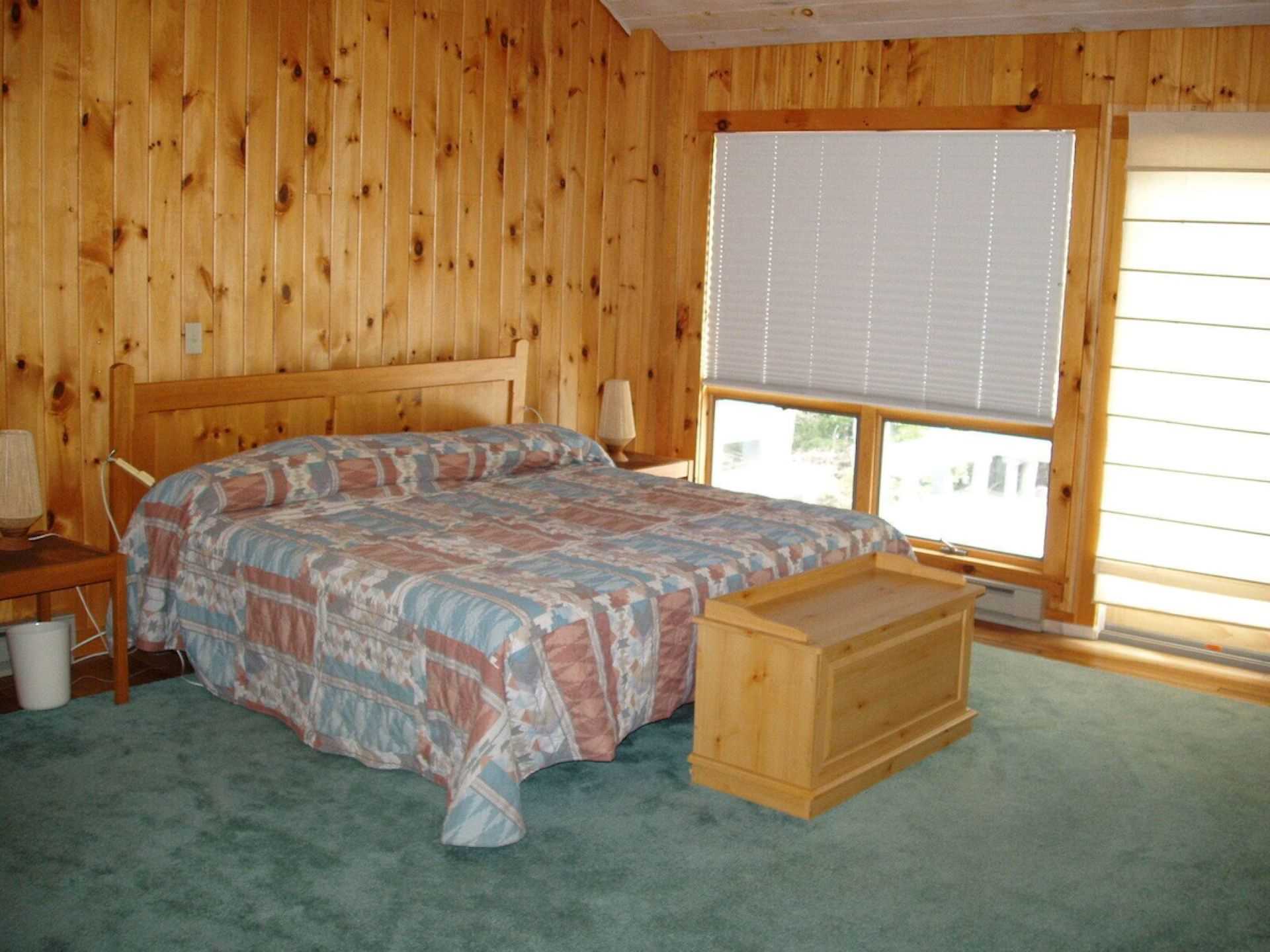 Vaulted ceiling spacious master bedroom with California king