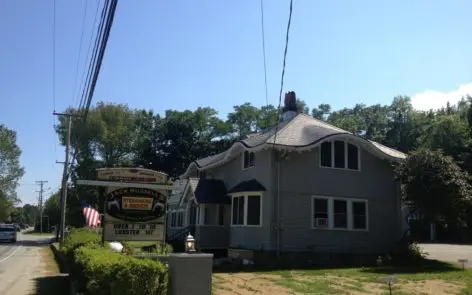 A house with a sign in front of it